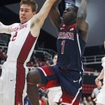 Arizona's Rawle Alkins (1) shoots as Stanford's Robert Cartwright defends during the first half of an NCAA college basketball game, Sunday, Jan. 1, 2017, in Stanford, Calif. (AP Photo/George Nikitin)