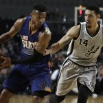 Phoenix Suns Leandro Barbosa, left, dribbles the ball under pressure from San Antonio Spurs Danny Green in the first half of their regular-season NBA basketball game in Mexico City, Saturday, Jan. 14, 2017. (AP Photo/Rebecca Blackwell)