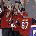 Arizona Coyotes center Ryan White, left, celebrates his goal against the Los Angeles Kings with left wing Lawson Crouse (67) and left wing Jordan Martinook, middle, during the second period of an NHL hockey game, Tuesday, Jan. 31, 2017, in Glendale, Ariz. (AP Photo/Ross D. Franklin)