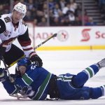 Vancouver Canucks center Michael Chaput (45) fights for control of the puck with Arizona Coyotes right wing Shane Doan (19) during the first period of an NHL hockey game, Wednesday, Jan. 4, 2017 in Vancouver, British Columbia. (Jonathan Hayward/The Canadian Press via AP)