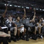 San Antonio Spurs players react from the bench during a play in the first half of their regular-season NBA basketball game in Mexico City, Saturday, Jan. 14, 2017. (AP Photo/Rebecca Blackwell)