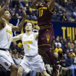 Arizona State's Shannon Evans II (11) drives to the basket against California's Ivan Rabb (1) and Grant Mullins (3) during the first half of an NCAA college basketball game, Sunday, Jan. 1, 2017, in Berkeley, Calif. (AP Photo/D. Ross Cameron)