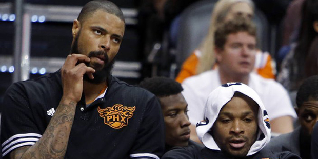 Phoenix Suns' Tyson Chandler and P.J. Tucker sit during the fourth quarter of the team's NBA basket...