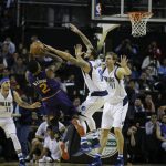Phoenix Suns Eric Bledsoe tries to shoot over Dallas Mavericks Deron Williams (8), and Dallas Mavericks Dirk Nowitzki (41) in the first half of their regular-season NBA basketball game in Mexico City, Thursday, Jan. 12, 2017. At left is Dallas Mavericks Seth Curry and at right is Phoenix Suns Tyson Chandler. (AP Photo/Rebecca Blackwell)