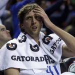 Dallas Mavericks Dirk Nowitzki rests on the bench during half-time at a regular-season NBA basketball game with the Phoenix Suns in Mexico City, Thursday, Jan. 12, 2017. (AP Photo/Rebecca Blackwell)
