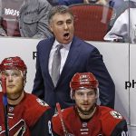 Arizona Coyotes coach Dave Tippett, top, argues with officials as he shouts over left wing Jamie McGinn (88) and center Alexander Burmistrov (91) during the third period of the team's NHL hockey game against the Los Angeles Kings on Tuesday, Jan. 31, 2017, in Glendale, Ariz. The Kings defeated the Coyotes 3-2. (AP Photo/Ross D. Franklin)