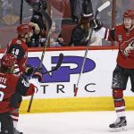 Arizona Coyotes left wing Lawson Crouse, right, celebrates his goal against the Vancouver Canucks with center Ryan White (25) and left wing Jordan Martinook (48) during the second period of an NHL hockey game Thursday, Jan. 26, 2017, in Glendale, Ariz. (AP Photo/Ross D. Franklin)