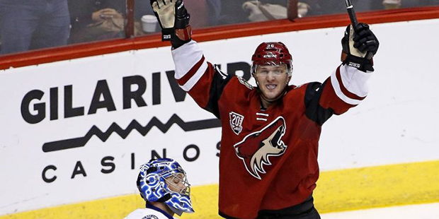 Arizona Coyotes right wing Christian Fischer, right, celebrates a goal in his first NHL hockey game...