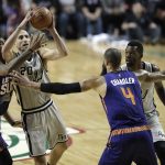 San Antonio Spurs Manu Ginobili, second left, drives the ball to the basket as Phoenix Suns Tyson Chandler, right, tries to block him, in the first half of their regular-season NBA basketball game in Mexico City, Saturday, Jan. 14, 2017. (AP Photo/Rebecca Blackwell)