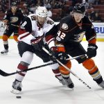 Arizona Coyotes' Tobias Rieder, left, and Anaheim Ducks' Josh Manson (42) battle for the puck in the first period of an NHL hockey game in Anaheim, Calif., Friday, Jan. 6, 2017. (AP Photo/Christine Cotter)