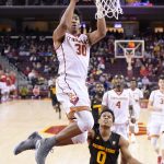 Southern California guard Elijah Stewart, left, goes up for a dunk as Arizona State guard Tra Holder watches during the first half of an NCAA college basketball game, Sunday, Jan. 22, 2017, in Los Angeles. (AP Photo/Mark J. Terrill)