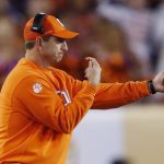 Clemson head coach Dabo Swinney signals to his players during the first half of the NCAA college football playoff championship game against Alabama Monday, Jan. 9, 2017, in Tampa, Fla. (AP Photo/John Bazemore)