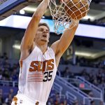 Phoenix Suns forward Dragan Bender dunks the ball against the Miami Heat during the first half of an NBA basketball game Tuesday, Jan. 3, 2017, in Phoenix. (AP Photo/Ross D. Franklin)