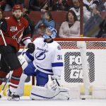 Arizona Coyotes center Martin Hanzal, second from left, celebrates a goal by teammate Tobias Rieder against Tampa Bay Lightning goalie Ben Bishop (30) as Lightning defenseman Nikita Nesterov (89) watches during the first period of an NHL hockey game Saturday, Jan. 21, 2017, in Glendale, Ariz. (AP Photo/Ross D. Franklin)