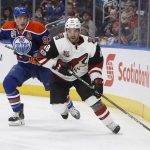Arizona Coyotes' Jordan Martinook (48) is chased by Edmonton Oilers' Ryan Nugent-Hopkins (93) during the third period of an NHL hockey game in Edmonton, Alberta, Monday, Jan. 16, 2017. (Jason Franson/The Canadian Press via AP)