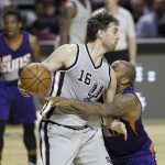 San Antonio Spurs Pau Gasol, left, is confronted by Phoenix Suns P.J. Tucker in the second half of their regular-season NBA basketball game in Mexico City, Saturday, Jan. 14, 2017. (AP Photo/Rebecca Blackwell)