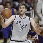 San Antonio Spurs Pau Gasol, front, takes control of the basketball as Phoenix Suns P.J. Tucker attempts to stop him in the second half of their regular-season NBA basketball game in Mexico City, Saturday, Jan. 14, 2017. (AP Photo/Rebecca Blackwell)