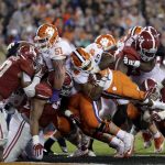 Clemson's Wayne Gallman (9) dives into the end zone for a touchdown turn during the second half of the NCAA college football playoff championship game against Alabama Tuesday, Jan. 10, 2017, in Tampa, Fla. (AP Photo/Chris O'Meara)