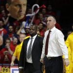 Arizona State head coach Bobby Hurley, right, stares down an official during the second half of an NCAA college basketball game against Arizona, Thursday, Jan. 12, 2017, in Tucson, Ariz. Arizona defeated Arizona State 91-75. (AP Photo/Rick Scuteri)