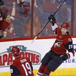 Arizona Coyotes left wing Brendan Perlini (29) celebrates his first goal during the first period of an NHL hockey game against the Winnipeg Jets with teammate right wing Shane Doan (19), Friday, Jan. 13, 2017, in Glendale, Ariz. (AP Photo/Ross D. Franklin)
