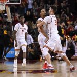 Southern California forward Nick Rakocevic, right, congratulates Jordan McLaughlin, right, as guard Jonah Mathews runs in after McLaughlin banked in a 3-pointer from just past the midcourt line to beat the halftime buzzer at the end of the first half of an NCAA college basketball game against Arizona State, Sunday, Jan. 22, 2017, in Los Angeles. (AP Photo/Mark J. Terrill)