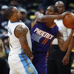 Denver Nuggets guard Jameer Nelson, left, defends as Phoenix Suns guard Brandon Knight looks to pass the ball in the first half of an NBA basketball game Thursday, Jan. 26, 2017, in Denver. (AP Photo/David Zalubowski)