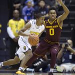 California's Charlie Moore (13) drives around Arizona State's Tra Holder (0) during the first half of an NCAA college basketball game, Sunday, Jan. 1, 2017, in Berkeley, Calif. (AP Photo/D. Ross Cameron)