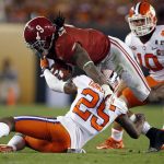 Alabama's Bo Scarbrough is stopped by Clemson's Cordrea Tankersley* during the second half of the NCAA college football playoff championship game Monday, Jan. 9, 2017, in Tampa, Fla. (AP Photo/John Bazemore)