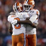 Clemson's Wayne Gallman celebrates his touchdown run with teammate Deon Cain (8) during the second half of the NCAA college football playoff championship game against Alabama Tuesday, Jan. 10, 2017, in Tampa, Fla. (AP Photo/Chris O'Meara)