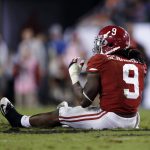 Alabama's Bo Scarbrough sits on the ground after being hurt during the second half of the NCAA college football playoff championship game against Clemson Monday, Jan. 9, 2017, in Tampa, Fla. (AP Photo/John Bazemore)