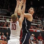 Arizona's Dusan Ristic shoots as Stanford's Michael Humphrey (10) defends during the first half of an NCAA college basketball game, Sunday, Jan. 1, 2017, in Stanford, Calif. (AP Photo/George Nikitin)