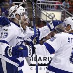 Tampa Bay Lightning center Cedric Paquette (13) celebrates his goal against the Arizona Coyotes with defenseman Anton Stralman (6) and center Gabriel Dumont during the first period of an NHL hockey game Saturday, Jan. 21, 2017, in Glendale, Ariz. (AP Photo/Ross D. Franklin)