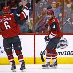 Arizona Coyotes left wing Jordan Martinook (48) celebrates his goal against the Los Angeles Kings with defenseman Jakob Chychrun (6) during the first period of an NHL hockey game, Tuesday, Jan. 31, 2017, in Glendale, Ariz. (AP Photo/Ross D. Franklin)
