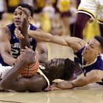 Arizona State forward Jethro Tshisumpa, left, and Washington's Carlos Johnson, rear, and Dominic Green, right, compete for the ball and look for the call during the first half of an NCAA college basketball game, Wednesday, Jan. 25, 2017, in Tempe, Ariz. (AP Photo/Matt York)
