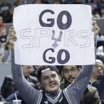 A Spurs fan shows his support for his team during a game against Phoenix in the second half of their regular-season NBA basketball game in Mexico City, Saturday, Jan. 14, 2017. (AP Photo/Rebecca Blackwell)