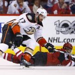 Anaheim Ducks center Ryan Kesler (17) controls the puck in front of Arizona Coyotes left wing Anthony Duclair, right, during the first period of an NHL hockey game Saturday, Jan. 14, 2017, in Glendale, Ariz. (AP Photo/Ross D. Franklin)