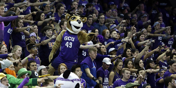 FILE - In this Dec. 3, 2016, file photo, Grand Canyon fans gesture before an NCAA college basketbal...