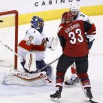 Florida Panthers goalie Roberto Luongo (1) gives up a goal, which became the game winner, by Arizona Coyotes right wing Tobias Rieder as Coyotes defenseman Alex Goligoski (33) tangles with Panthers defenseman Keith Yandle (3) during overtime of an NHL hockey game Monday, Jan. 23, 2017, in Glendale, Ariz. The Coyotes defeated the the Panthers 3-2. (AP Photo/Ross D. Franklin)