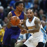 Phoenix Suns guard Eric Bledsoe, left, looks to pass the ball as Denver Nuggets guard Jameer Nelson defends in the first half of an NBA basketball game Thursday, Jan. 26, 2017, in Denver. (AP Photo/David Zalubowski)