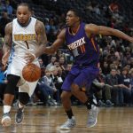 Denver Nuggets guard Jameer Nelson, left, pursues a loose ball with Phoenix Suns guard Brandon Knight in the first half of an NBA basketball game Thursday, Jan. 26, 2017, in Denver. (AP Photo/David Zalubowski)