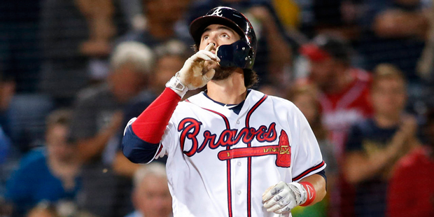 Atlanta Braves' Dansby Swanson celebrates at home plate after hitting a a solo home run during the ...