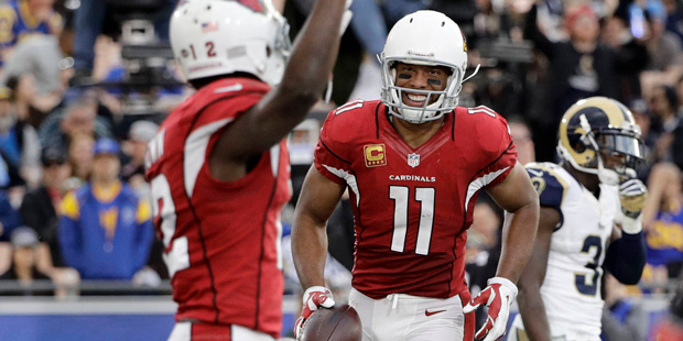 Arizona Cardinals wide receiver Larry Fitzgerald, right, celebrates with wide receiver John Brown a...