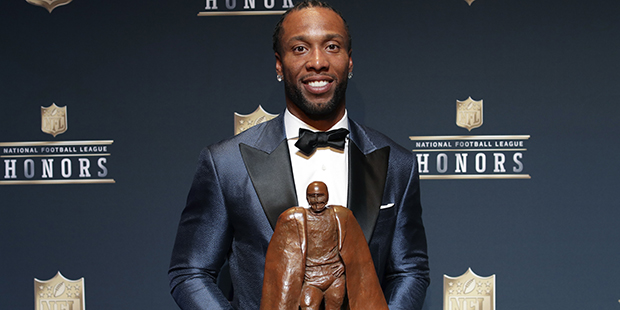 Larry Fitzgerald of the Arizona Cardinals, winner of the Walter Payton NFL Man of the Year award, p...