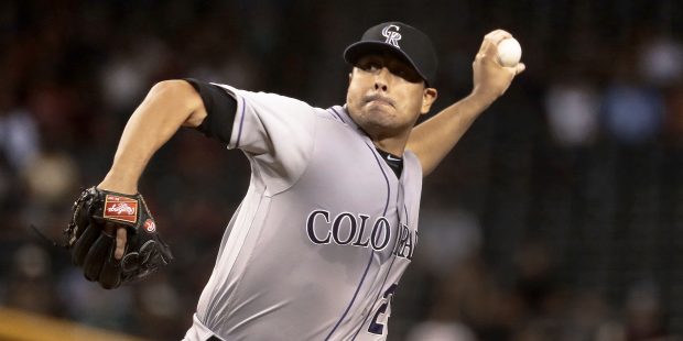 Colorado Rockies pitcher Jorge De La Rosa throws during the third inning of a baseball game against...