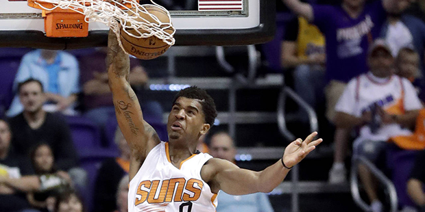 Phoenix Suns forward Marquese Chriss (0) dunks over Los Angeles Lakers center Tarik Black (28) duri...