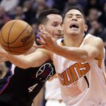 Phoenix Suns guard Devin Booker (1) loses the balls as Los Angeles Clippers guard J.J. Redick (4) defends during the second half of an NBA basketball game, Wednesday, Feb. 1, 2017, in Phoenix. (AP Photo/Matt York)