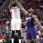 Houston Rockets' James Harden (13) shoots as Phoenix Suns' P.J. Tucker (17) defends during the first half of an NBA basketball game, Saturday, Feb. 11, 2017, in Houston. (AP Photo/David J. Phillip)