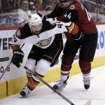 Anaheim Ducks center Nate Thompson (44) shields the puck from Arizona Coyotes defenseman Kevin Connauton in the first period during an NHL hockey game, Monday, Feb. 20, 2017, in Glendale, Ariz. (AP Photo/Rick Scuteri)