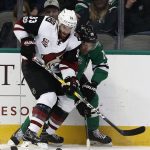 Arizona Coyotes' Alex Goligoski (33) and Dallas Stars' Patrick Sharp (10) battle for the puck during the second period of an NHL hockey game, Friday, Feb. 24, 2017, in Dallas. (AP Photo/Mike Stone)