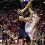 Phoenix Suns' Alex Len, left, is fouled by Houston Rockets' Ryan Anderson (3) during the second half of an NBA basketball game Saturday, Feb. 11, 2017, in Houston. The Rockets won 133-102. (AP Photo/David J. Phillip)